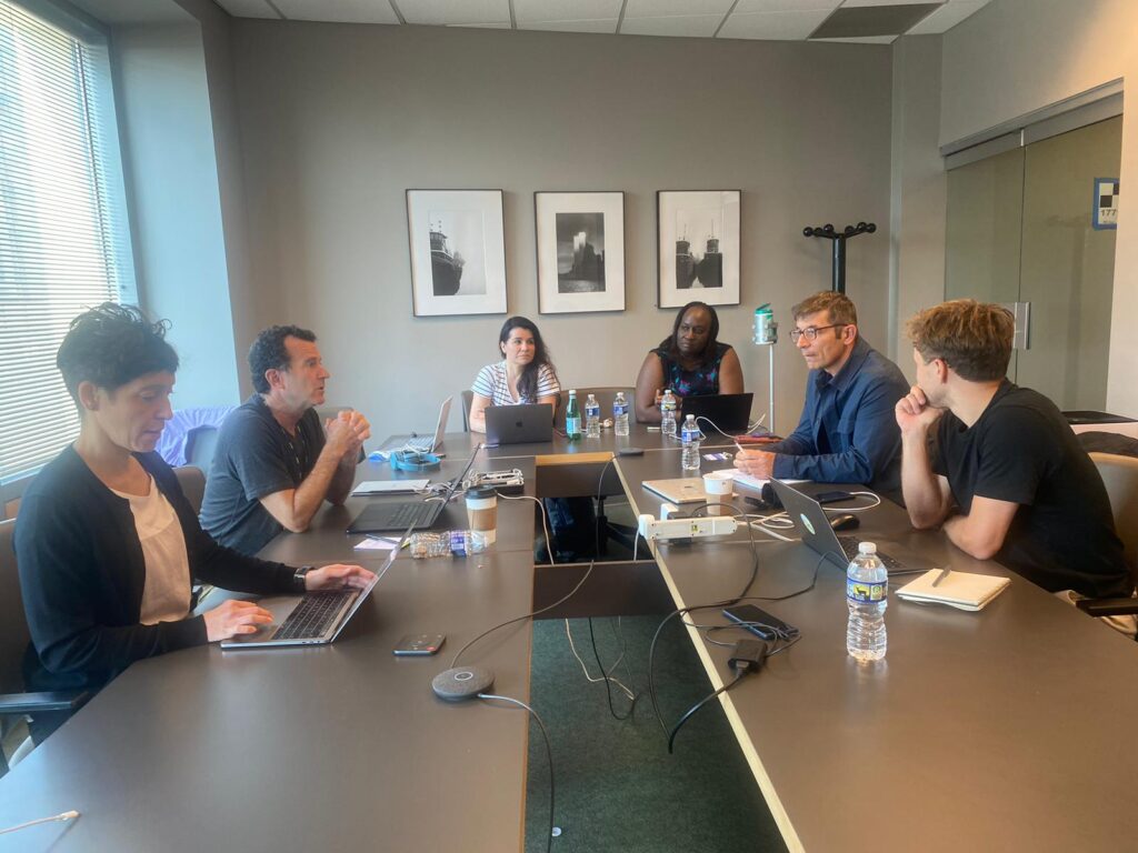 Picture of the core team in a meeting room