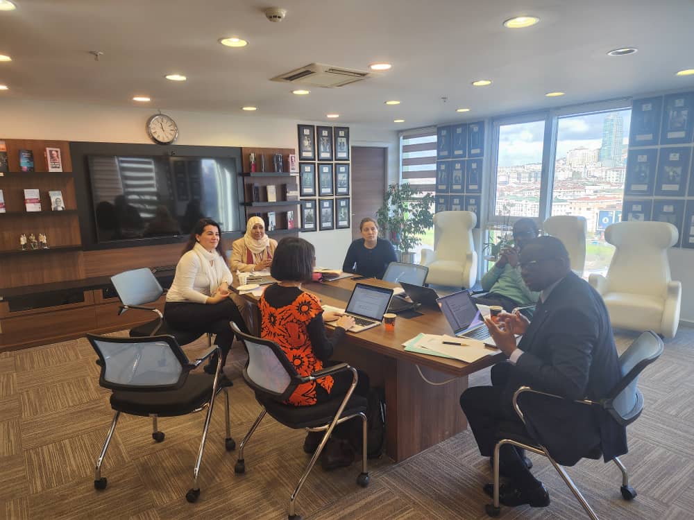 Photo showing commissioners working at a round table