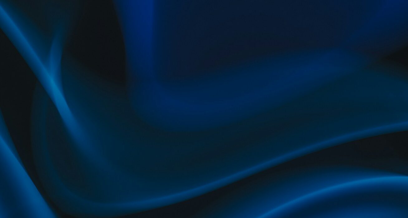 a blue and black background with wavy lines